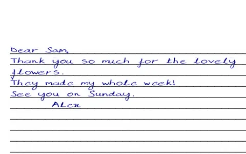 A thank-you note in blue handwriting on ruled paper